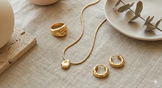 Three-piece minimalist gold jewelry capsule wardrobe - sculptural ring and necklace