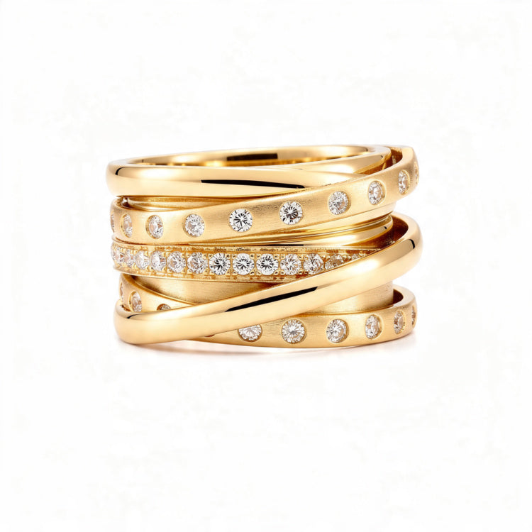 A polished 18K gold statement ring with multiple intertwined bands, featuring rows of small round diamonds, displayed centered on a pure white background.