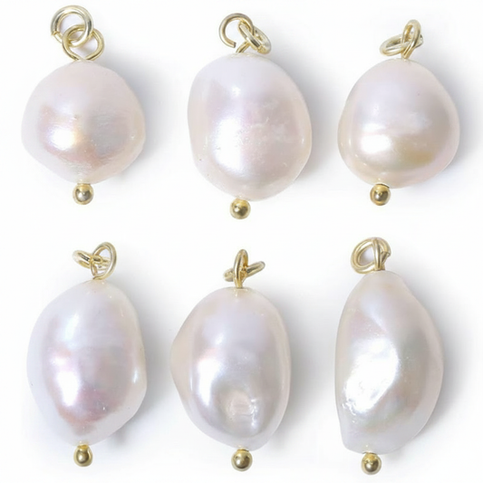 Six unique, irregular-shaped baroque pearls with a high-luster iridescent finish and gold-tone jump rings, arranged on a clean white background for a minimalist jewelry display.