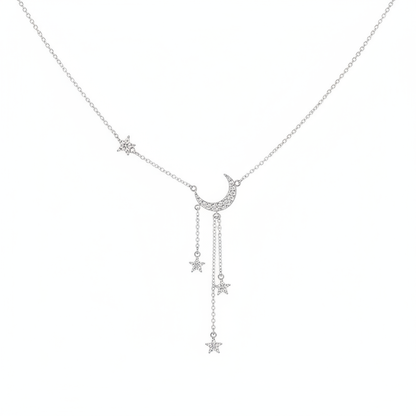 A delicate silver-tone Y-shaped necklace featuring a pave-set crystal crescent moon center with three dangling star charms on fine chains, shown against a clean white background.