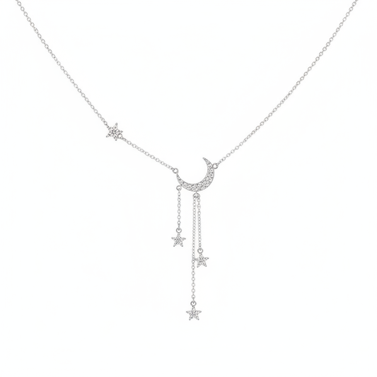 A delicate silver-tone Y-shaped necklace featuring a pave-set crystal crescent moon center with three dangling star charms on fine chains, shown against a clean white background.