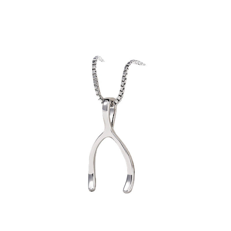 Polished silver wishbone pendant on a sleek box chain necklace, minimalist jewelry for women, white gold finish.