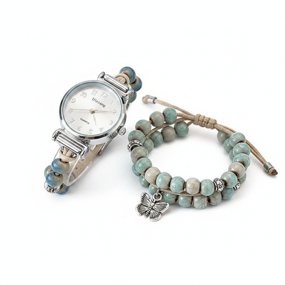 A bohemian-inspired jewelry set featuring a silver-toned watch integrated into a beaded cord strap, paired with a matching double-layer turquoise-style beaded bracelet and a detailed butterfly charm.