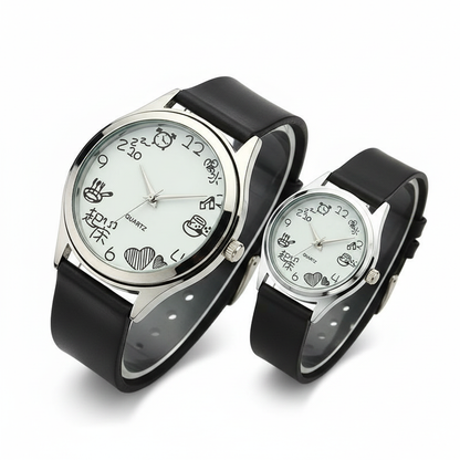 A charming pair of minimalist silver-toned watches featuring hand-drawn style illustrations on a clean white dial, paired with soft matte black straps for a creative and unique aesthetic.