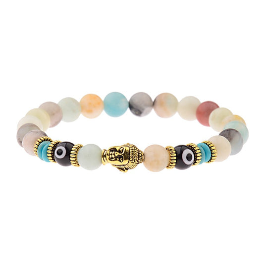 Spiritual beaded bracelet featuring multi-colored natural stone beads, a golden Buddha head charm, and black evil eye beads with gold-tone accents.