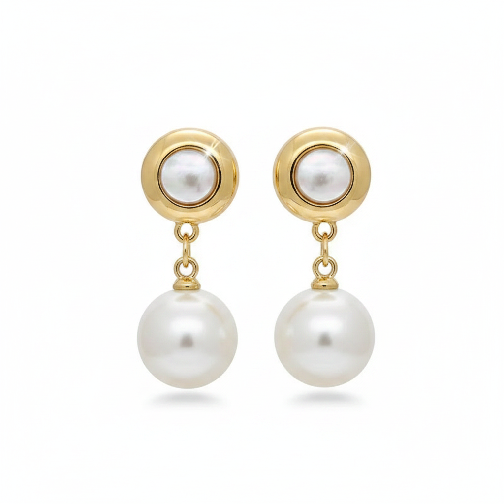 Elegant gold-toned drop earrings featuring round bezel-set pearls and hanging white pearl pendants on a white background