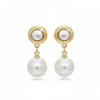 Elegant gold-toned drop earrings featuring round bezel-set pearls and hanging white pearl pendants on a white background